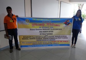 Gingoog Rotarians with welcome banner.